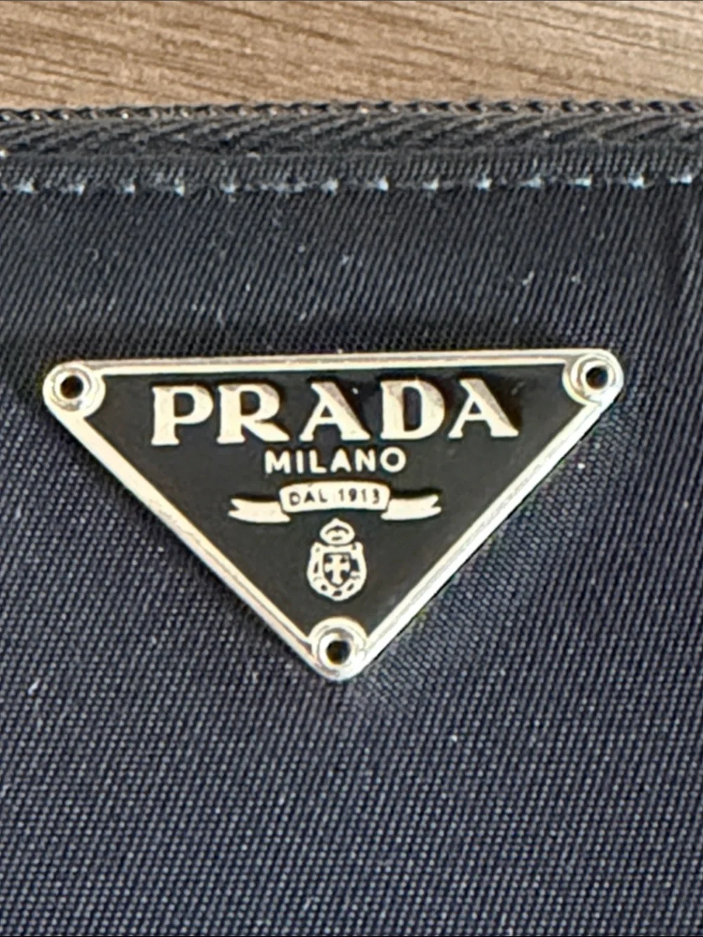 Prada Bifold  Black Zip-Around Card Wallet with Silver Triangle Emblem
